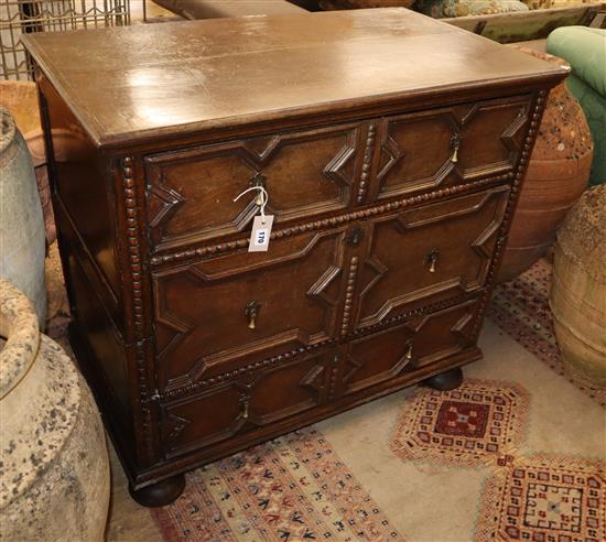 A 17th century oak two part chest, W.95cm D.54cm H.86cm